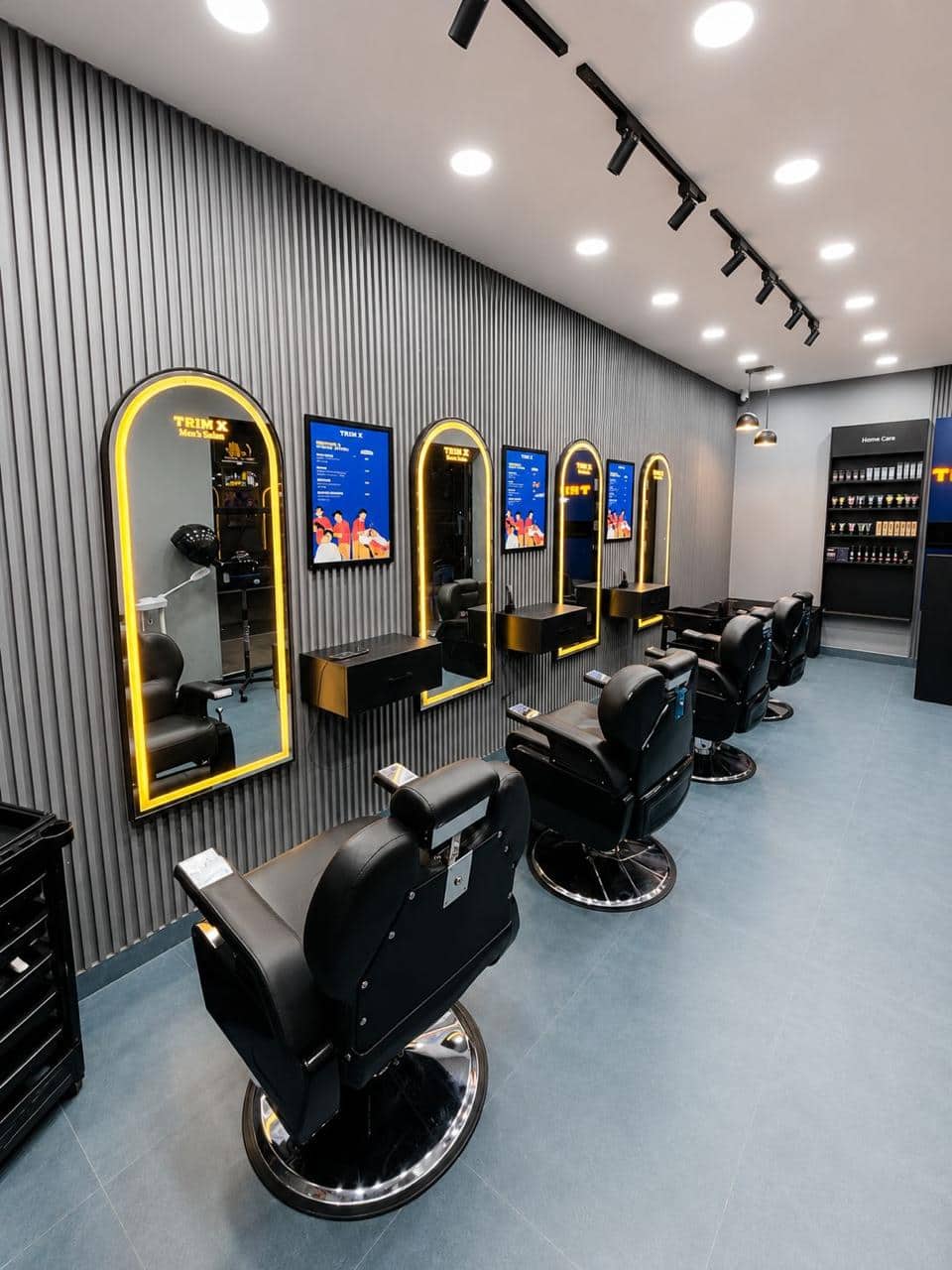 The chair row and lit arch mirrors in a TrimX salon