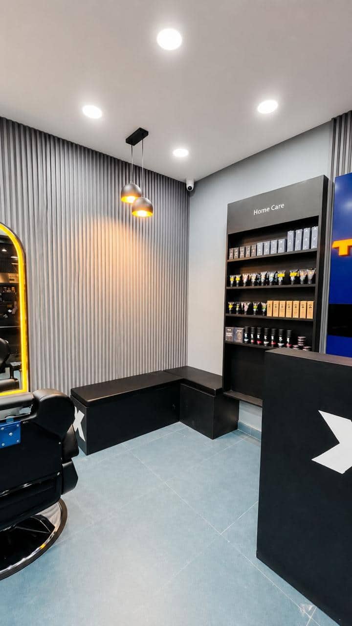 The waiting bench and Home Care shelf inside a TrimX salon